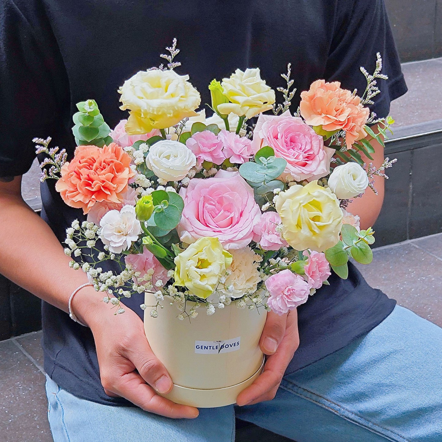 Assorted Pink and Yellow Flowers in Small Paper Box Arrangement