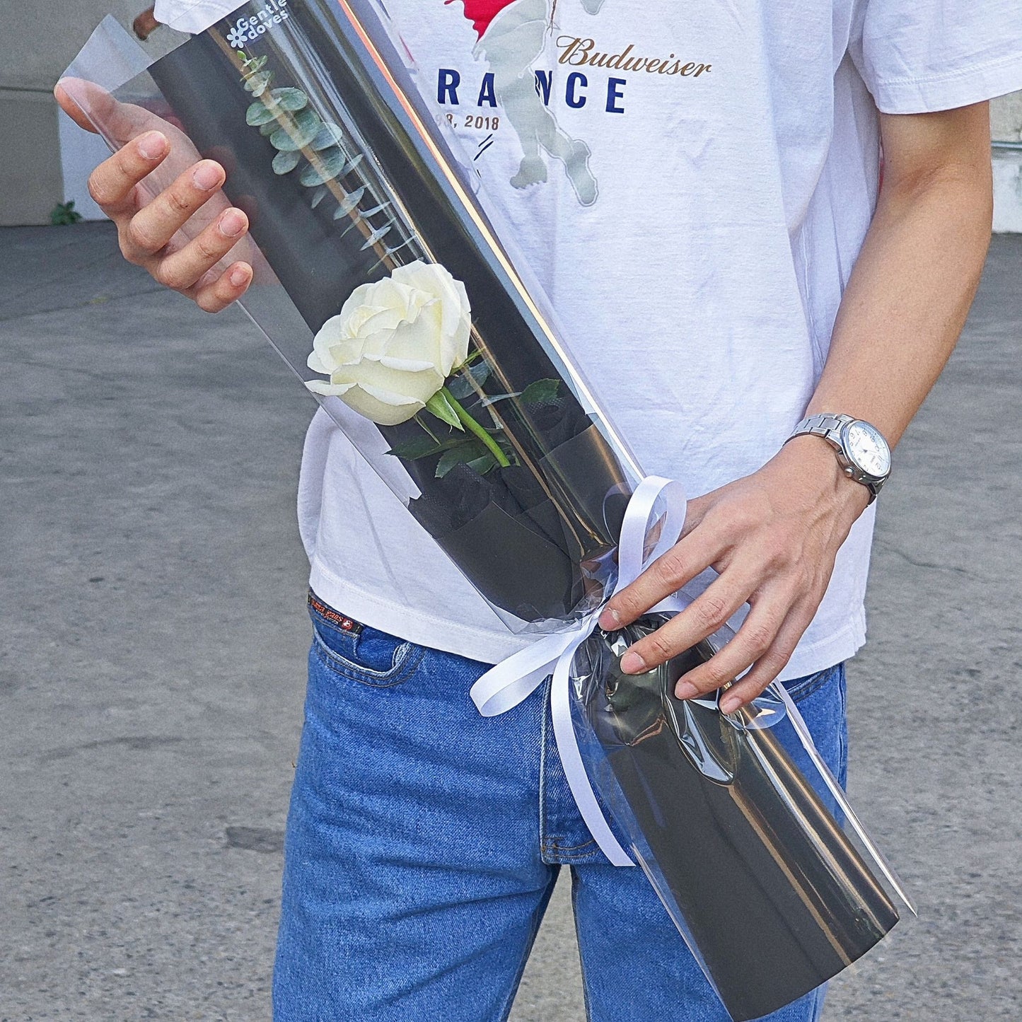 Single White Rose with Eucalyptus in Black Paper Cylinder Bouquet