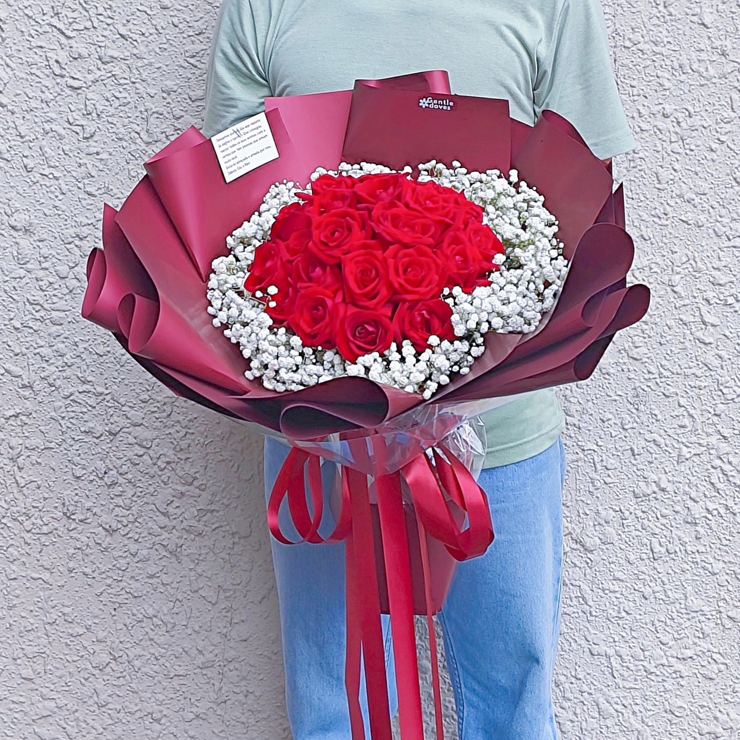 Twenty Four Red Roses Surrouded with Gypsophila in Red Paper Bouquet