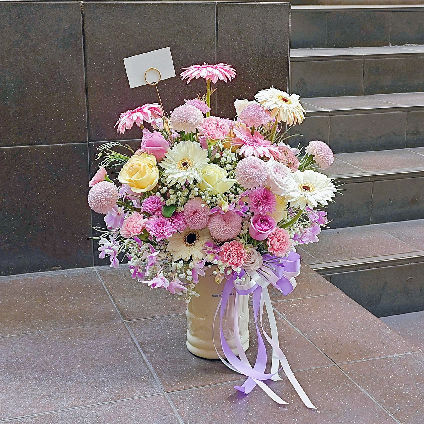 Assorted Pastel Pink and Purple Flowers in Large Ceramic Vase Arrangement