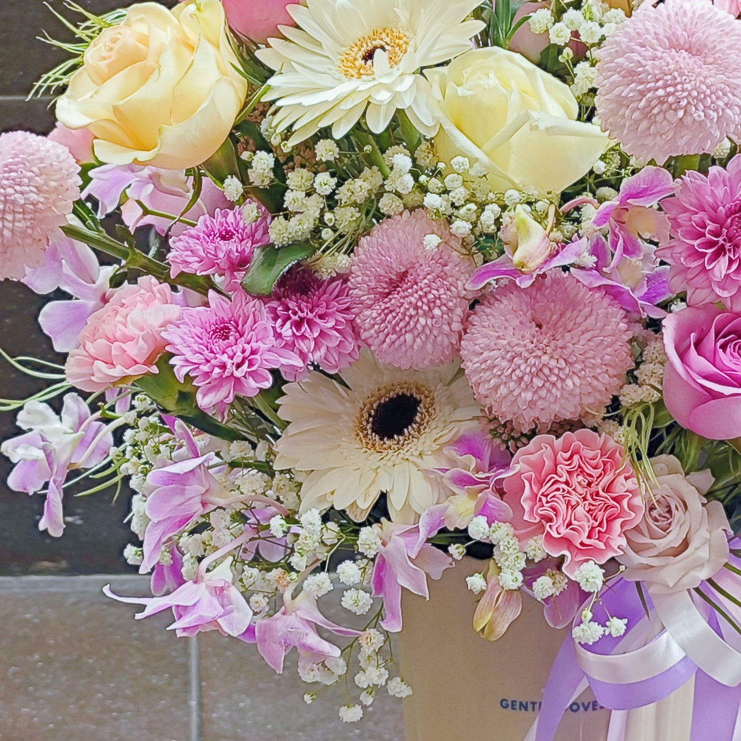 Assorted Pastel Pink and Purple Flowers in Large Ceramic Vase Arrangement