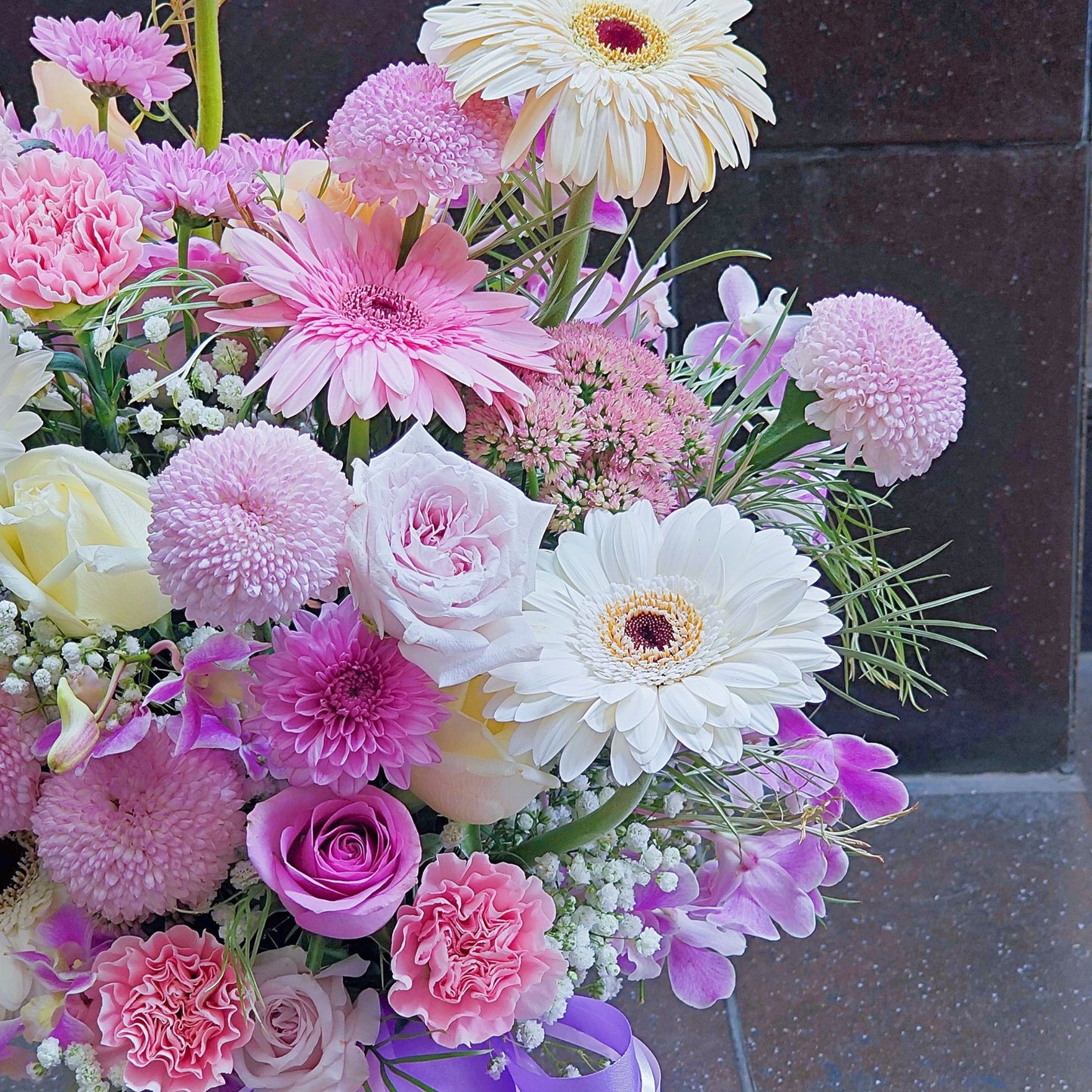 Assorted Pastel Pink and Purple Flowers in Large Ceramic Vase Arrangement