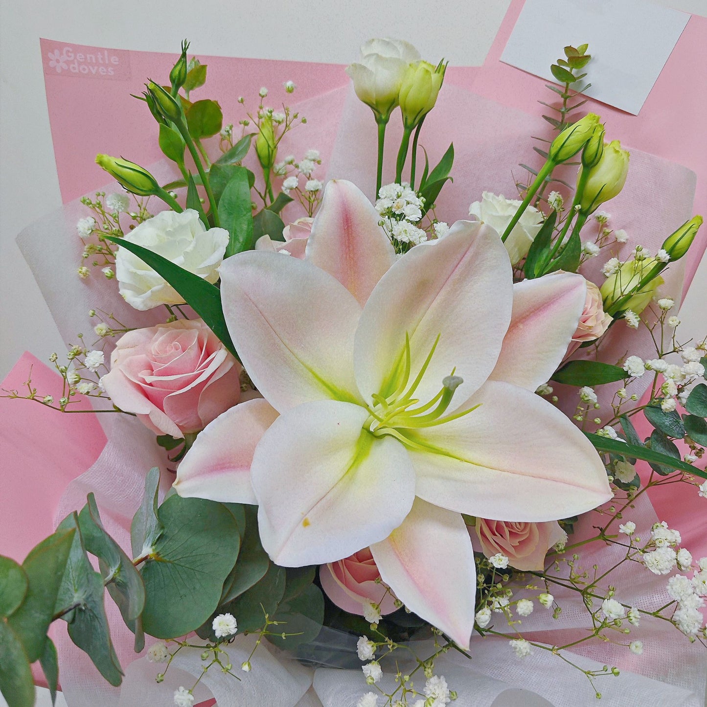 Single Stem Pink Lily with Assorted Pink and White Flowers and Green Foliage Bouquet