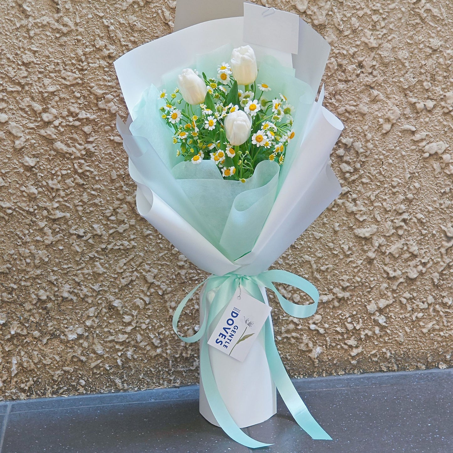 Three White Tulips with Daisies in Soft Green and White Paper Bouquet