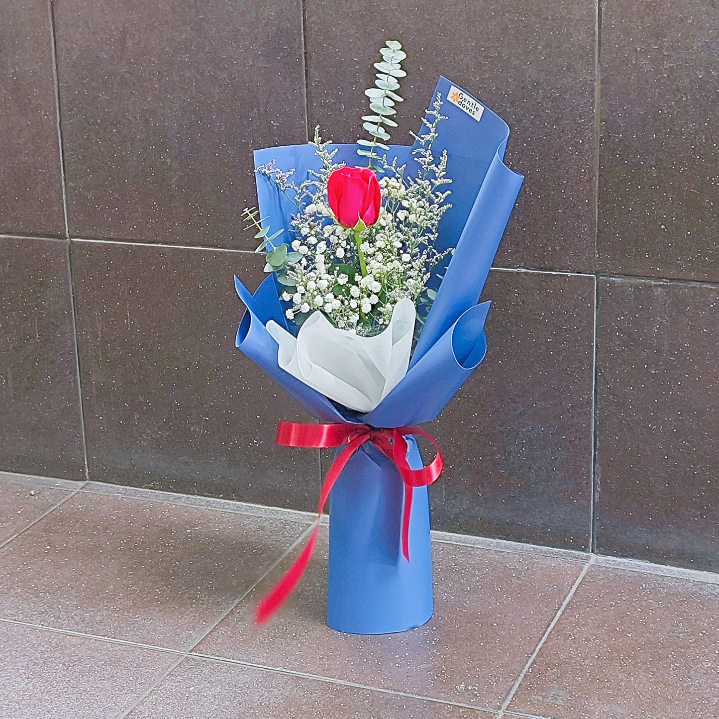 Single Red Rose with Foliage in Blue Paper Bouquet