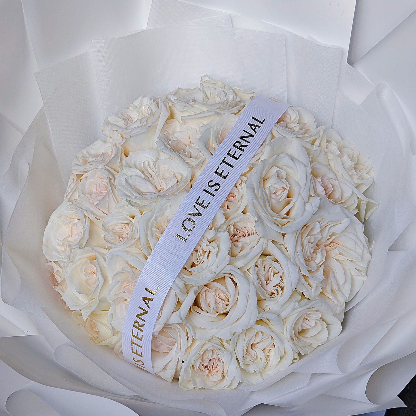 Thirty White English Roses in White Paper Bouquet