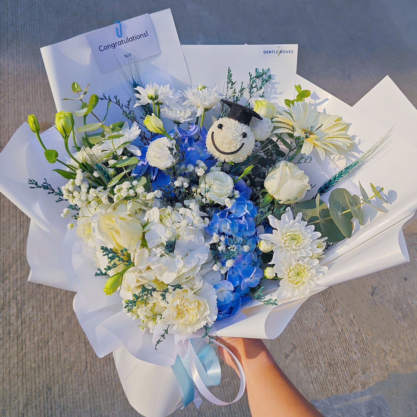 Assorted White and Blue Flowers with Graduated Smiley Face Bouquet