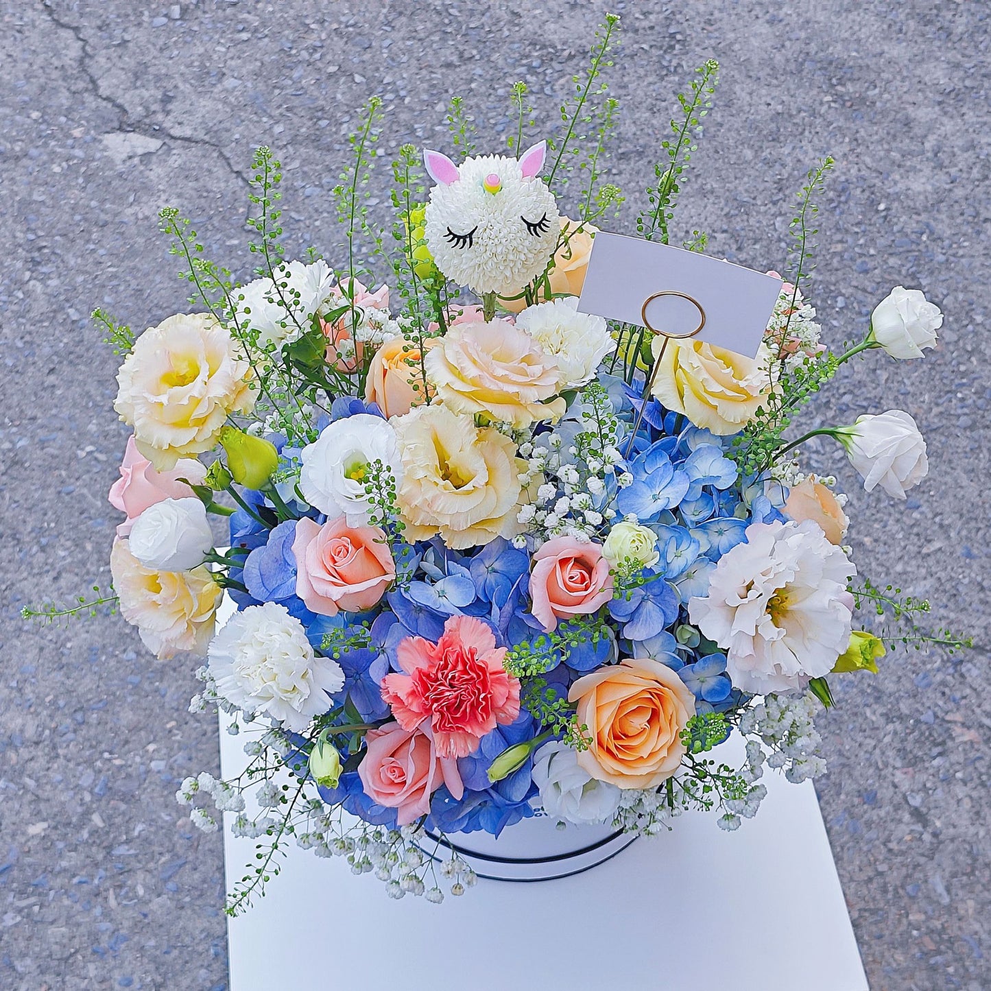 Soft Blue Hydrangea with Soft Color Flowers with Sleeping Unicorn in Medium Box Arrangement