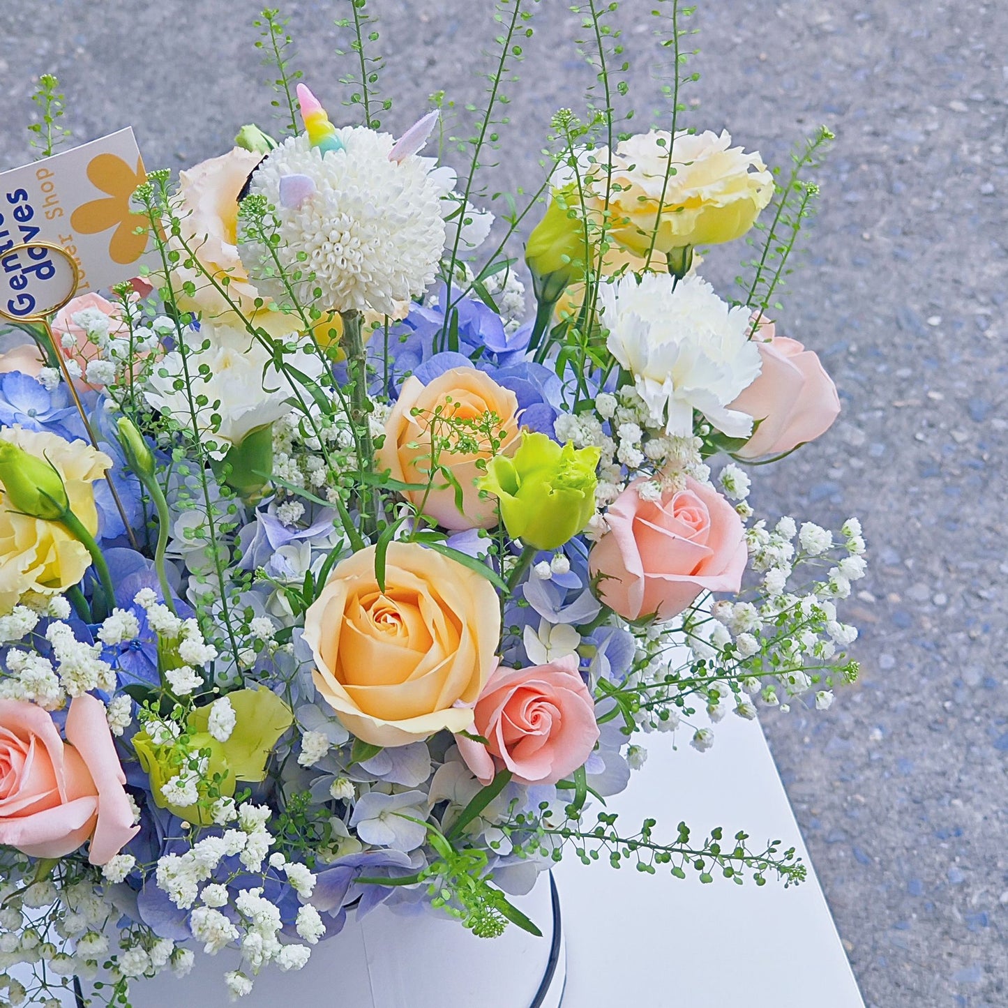 Soft Blue Hydrangea with Soft Color Flowers with Sleeping Unicorn in Medium Box Arrangement