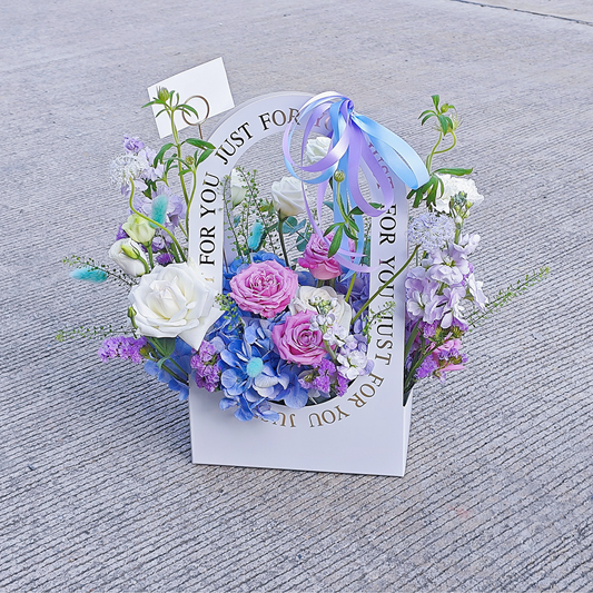 Assorted Soft Purple, Blue and White Flowers in Medium Carrying Flower Box