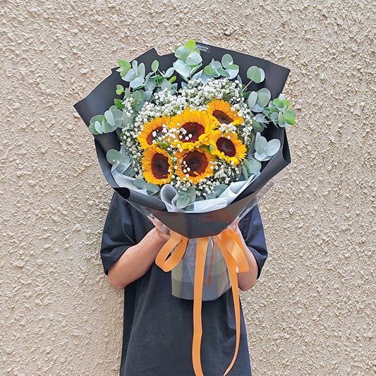 Six Sunflowers with Gypsophila and Eucalyptus in Black Paper Bouquet