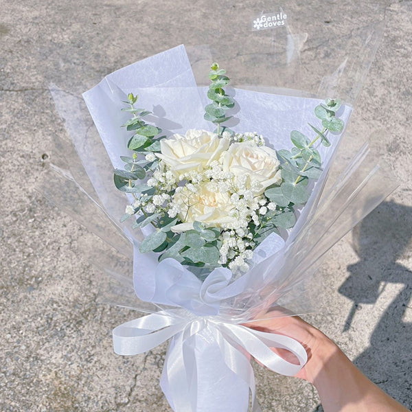 Three White English Roses with Gypsophila and Eucalyptus in White Paper Minimal Bouquet
