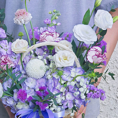 Assorted Purple Flowers in Small Basket Arrangement