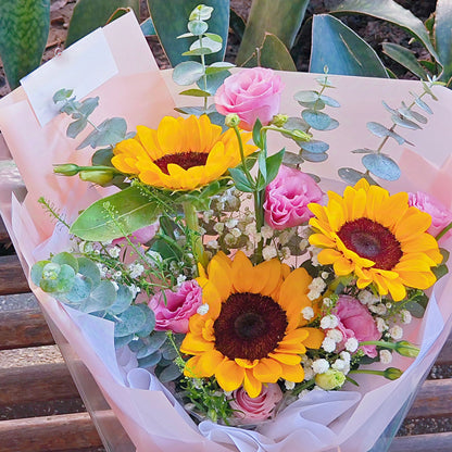 Three Sunflowers with Pink Lisianthus and Green Foliage Bouquet