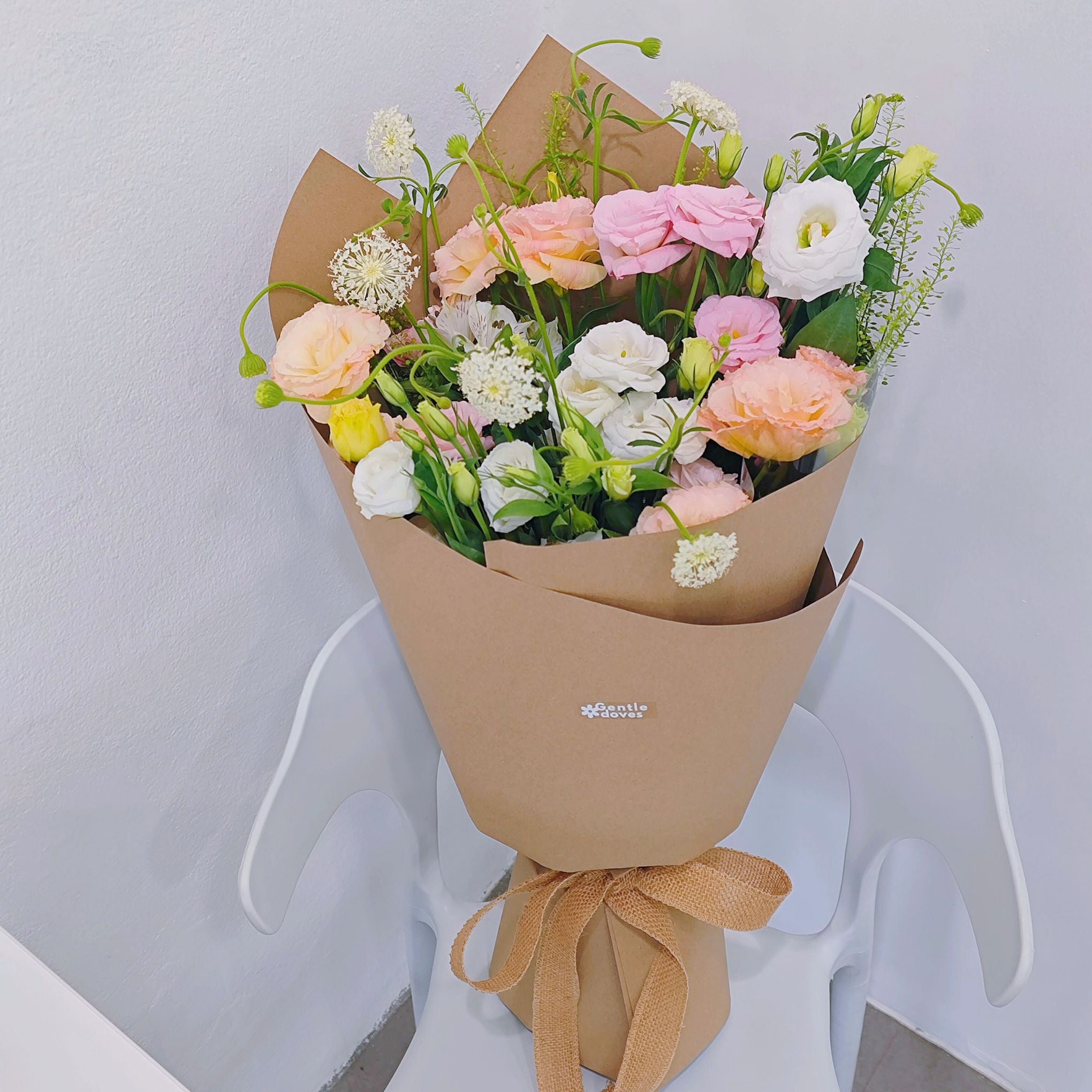 Assorted Soft Color Lisianthus and Filler Flower in Craft Paper Bouquet