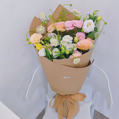 Assorted Soft Color Lisianthus and Filler Flower in Craft Paper Bouquet