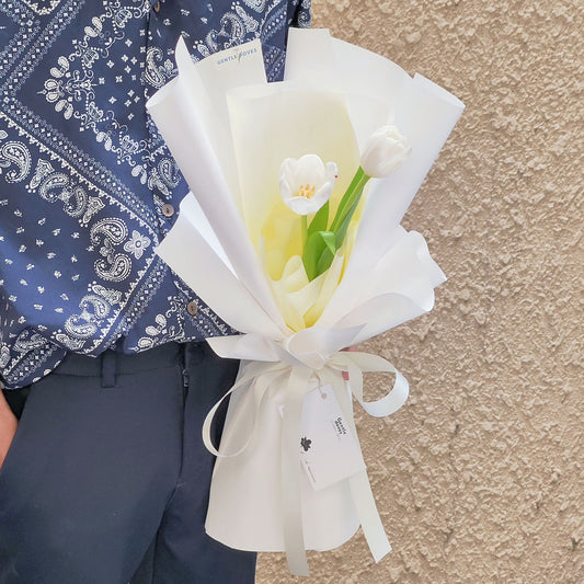 Two White Tulips in White Paper Bouquet