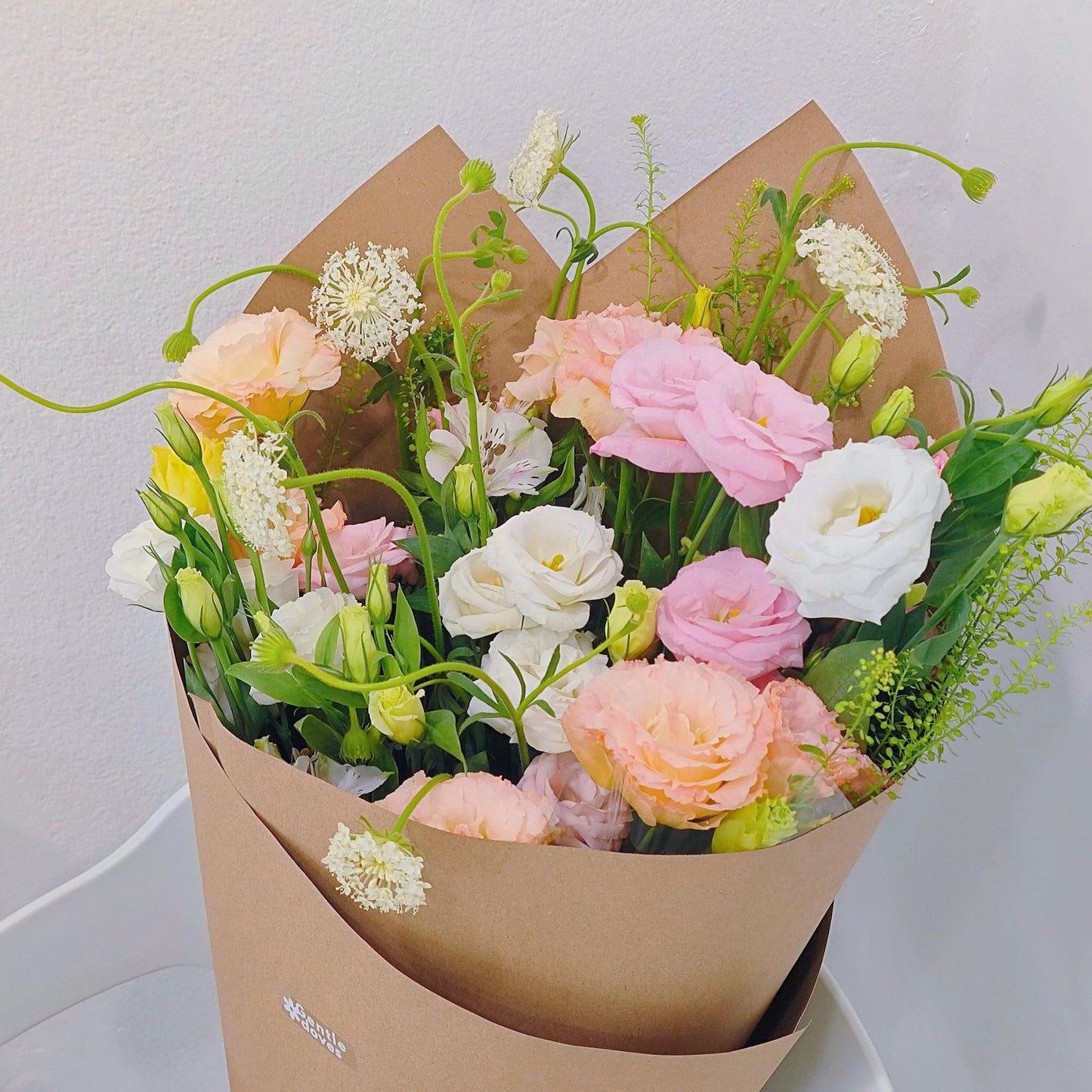 Assorted Soft Color Lisianthus and Filler Flower in Craft Paper Bouquet