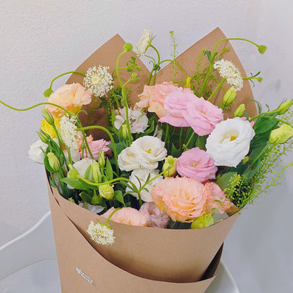 Assorted Soft Color Lisianthus and Filler Flower in Craft Paper Bouquet