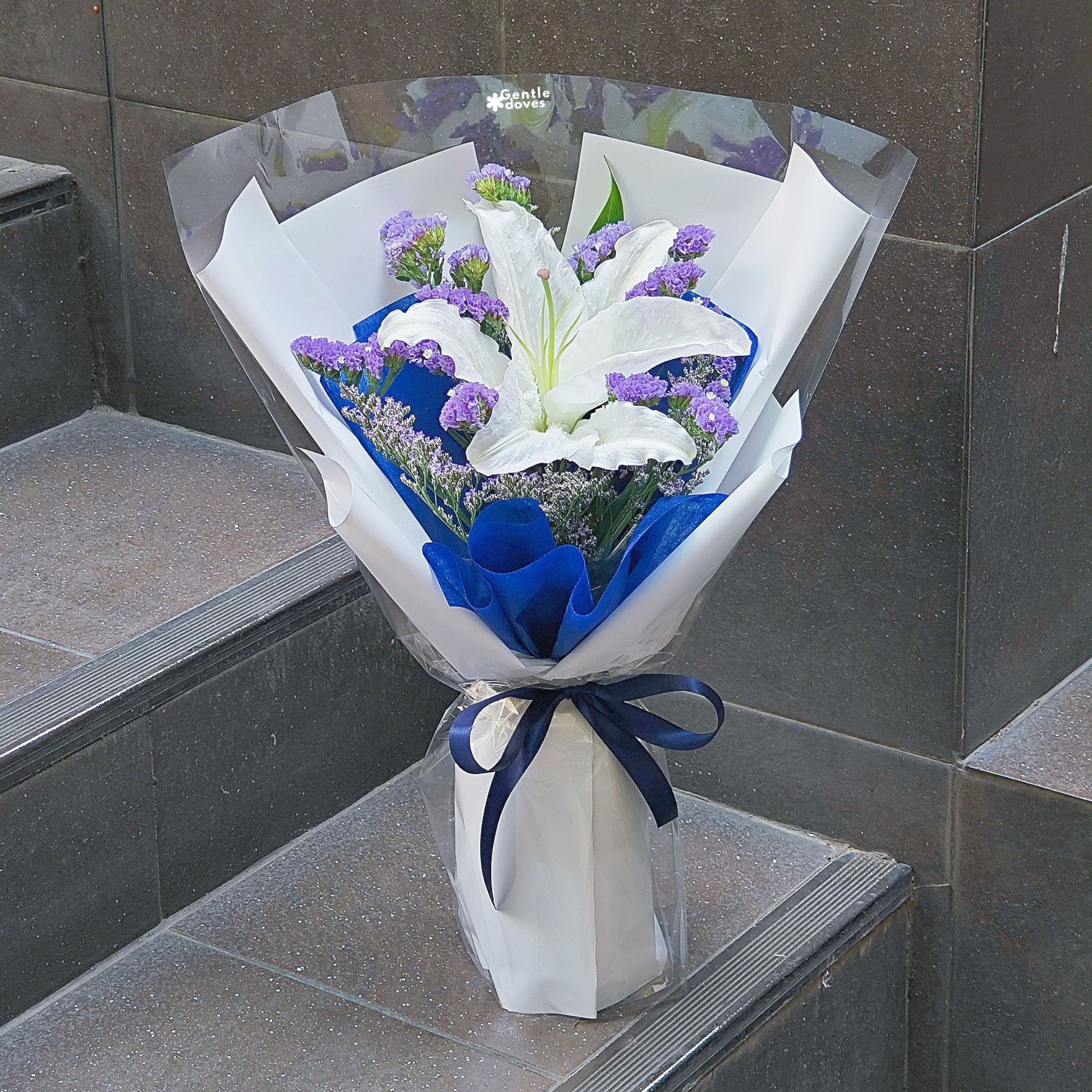 blue and white lily bouquet Single White Lily Stem with Blue Statice Small Bouquet – Gentle Doves Flower Shop