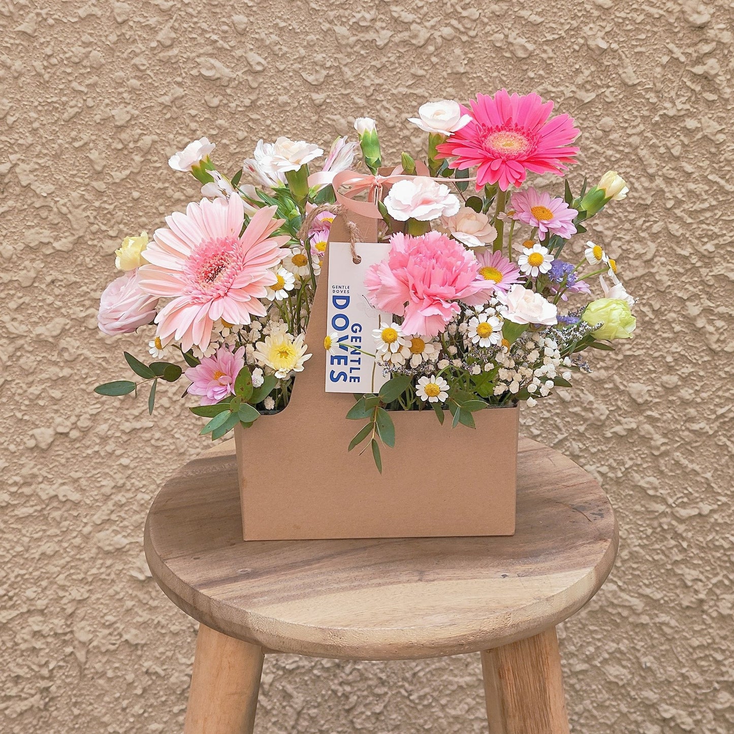 Assorted Pink Flowers and Filler Flowers in Carrying Small Box