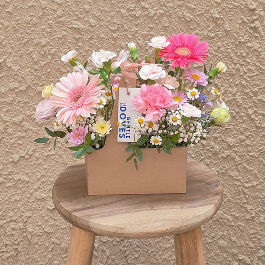 Assorted Pink Flowers and Filler Flowers in Carrying Small Box