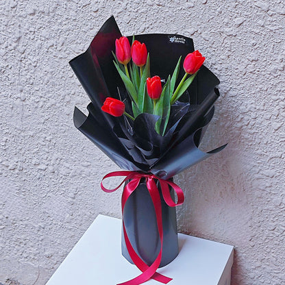 Red Tulips in Black Paper Bouquet