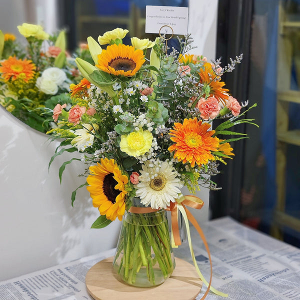 Assorted Warm Flowers in Extra Large Vase Arrangement