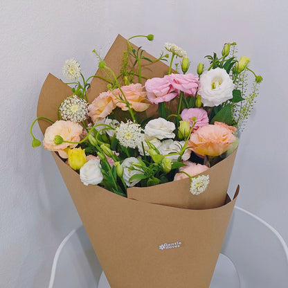 Assorted Soft Color Lisianthus and Filler Flower in Craft Paper Bouquet