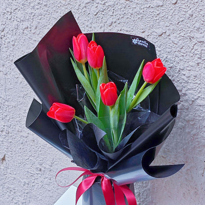 Red Tulips in Black Paper Bouquet