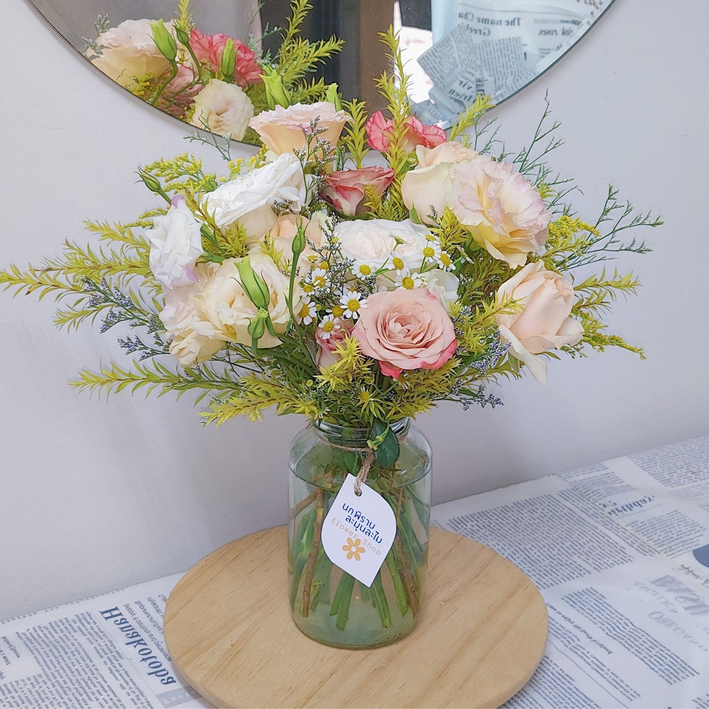 Assorted Soft Yellow and Warm Color Flowers in Medium Vase Arrangement