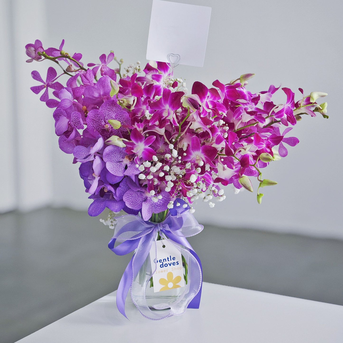 Purple Orchids Flowers in Large Vase Arrangement