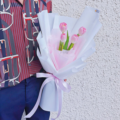 Four Soft Pink Tulips in White and Pink Paper Bouquet