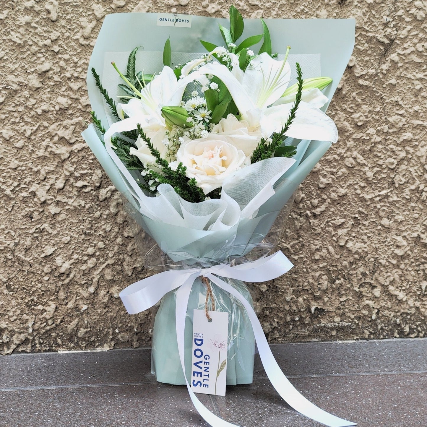 White Lilies with White Roses and Foliage Small Bouquet