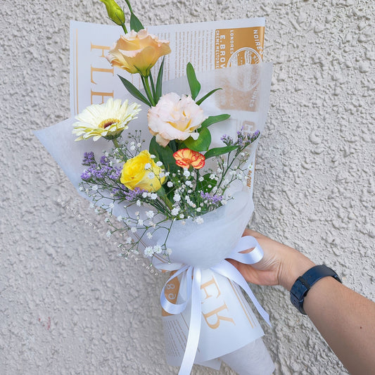 Assorted Cheerful Flowers in Newspaper Wrapping Small Bouquet