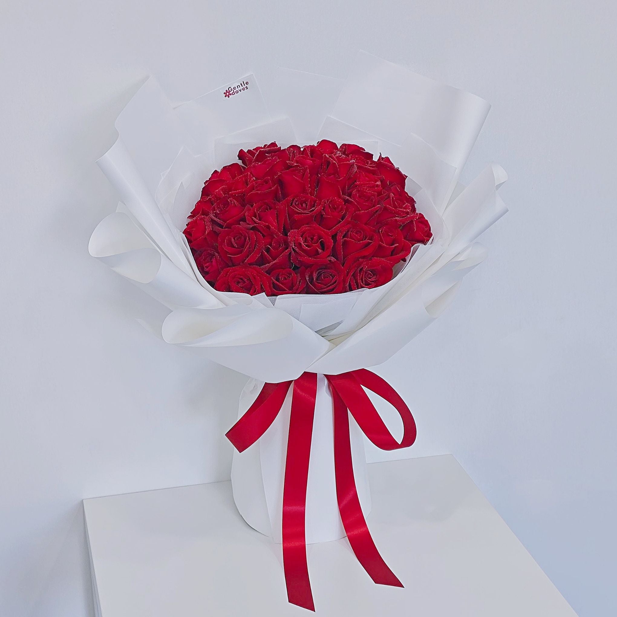 Forty Red Roses in White Paper Bouquet