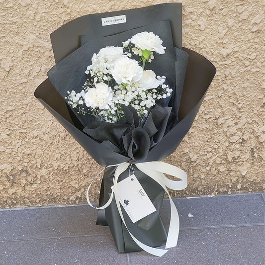 Five White Carnations with Gypsophila in Black Paper Bouquet