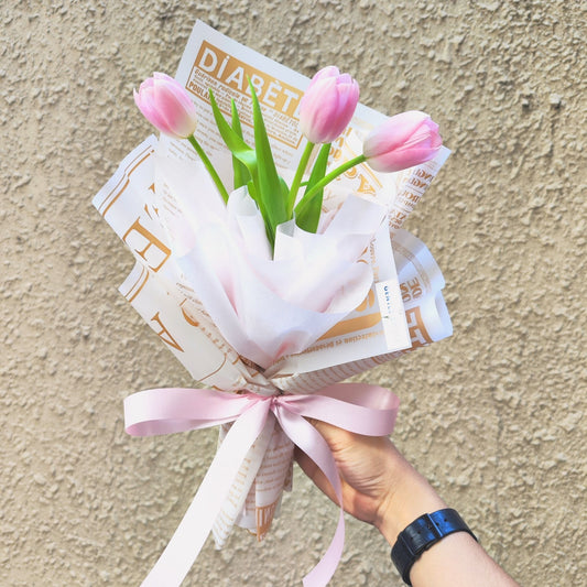 Three Soft Pink Tulips in Newspaper Bouquet