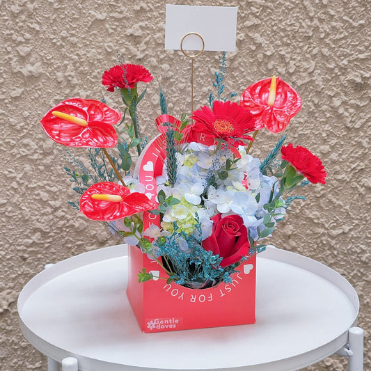 Assorted Red and Blue Flowers in a Mini Box Arrangement