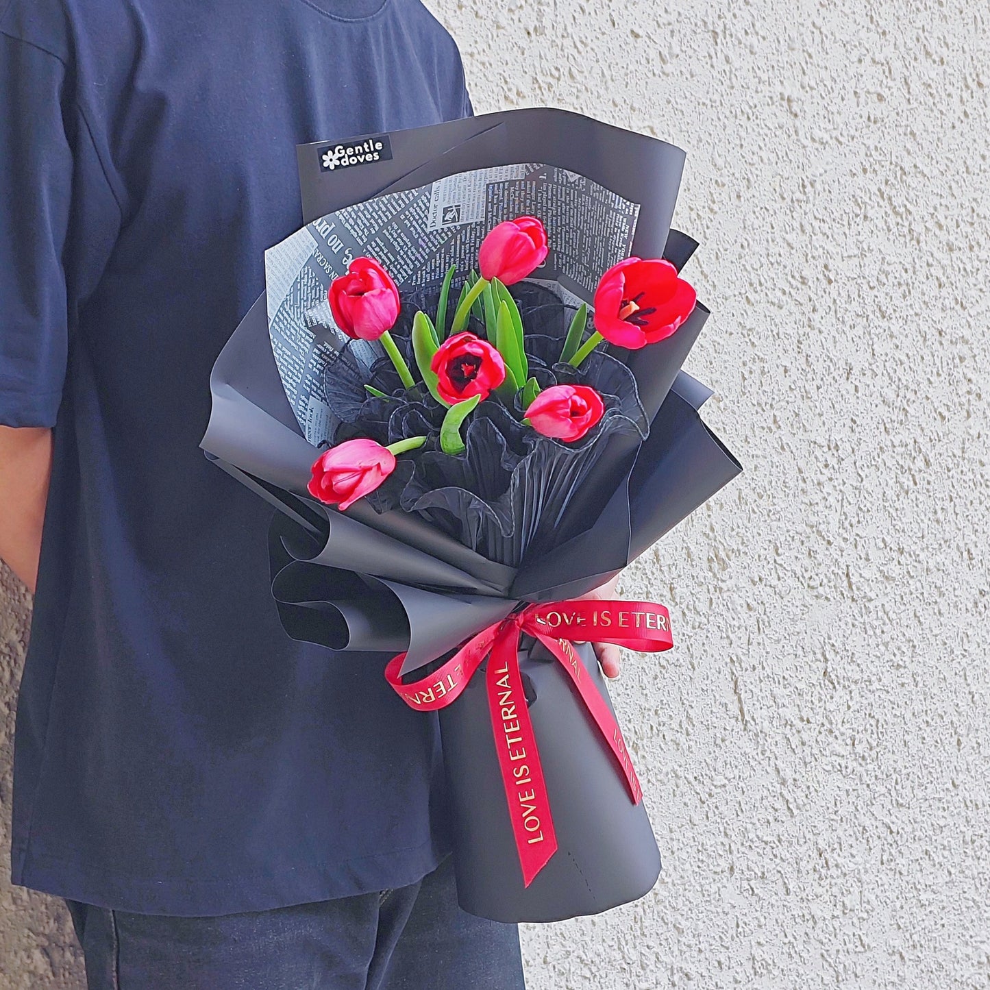 Six Red Tulips in Black Paper Bouquet