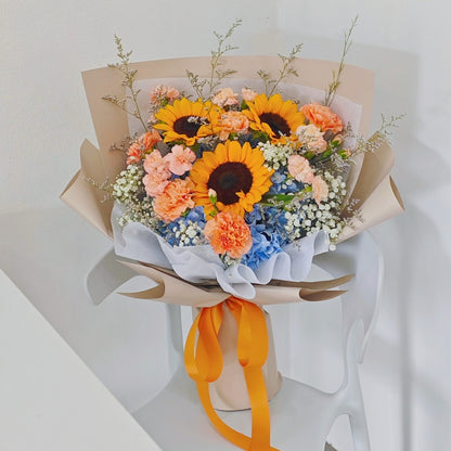 Three Sunflowers with Blue Hydrangeas and Assorted Orange Flowers Large Bouquet